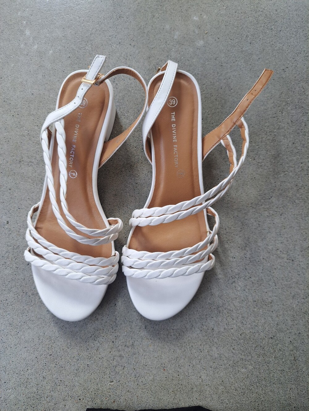 White sandals with low heels